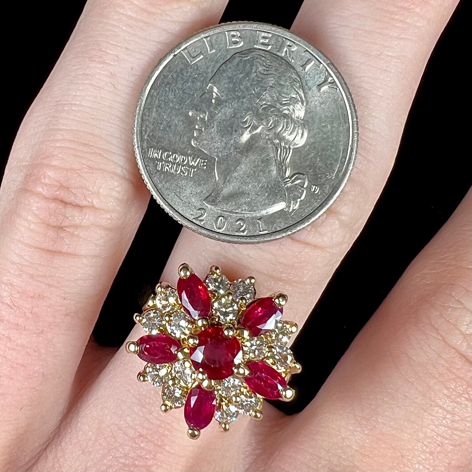 A ladies' vintage yellow gold cluster ring set with diamonds and pigeon blood red Burma rubies.