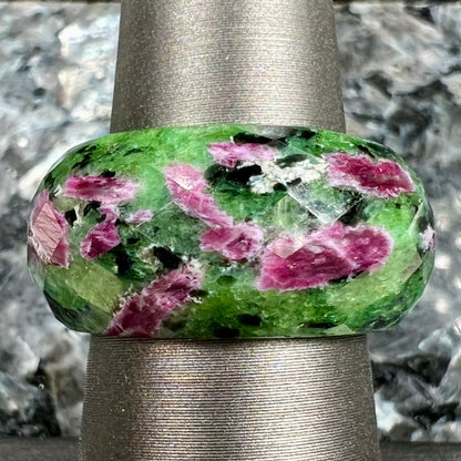 A faceted, carved stone ring made form ruby in zoisite.