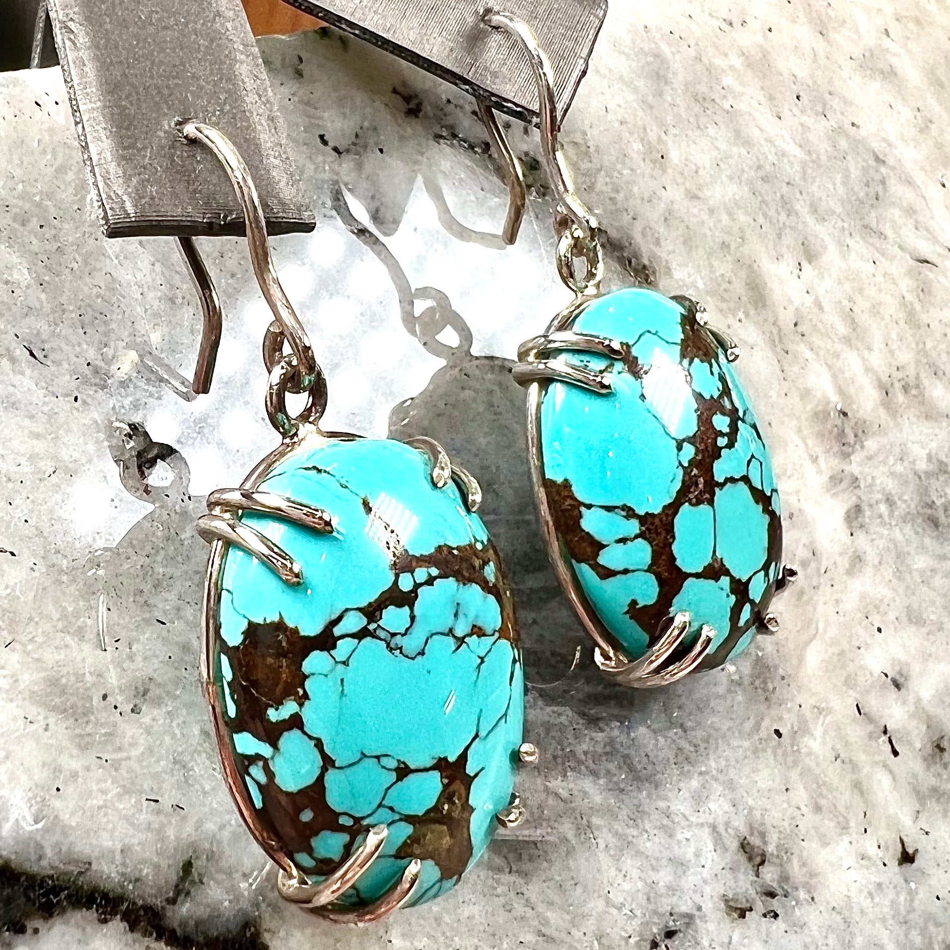 Sterling silver French wire earrings double prong set with cabochon cut turquoise from Valley Blue Mine in Lander County, Nevada.