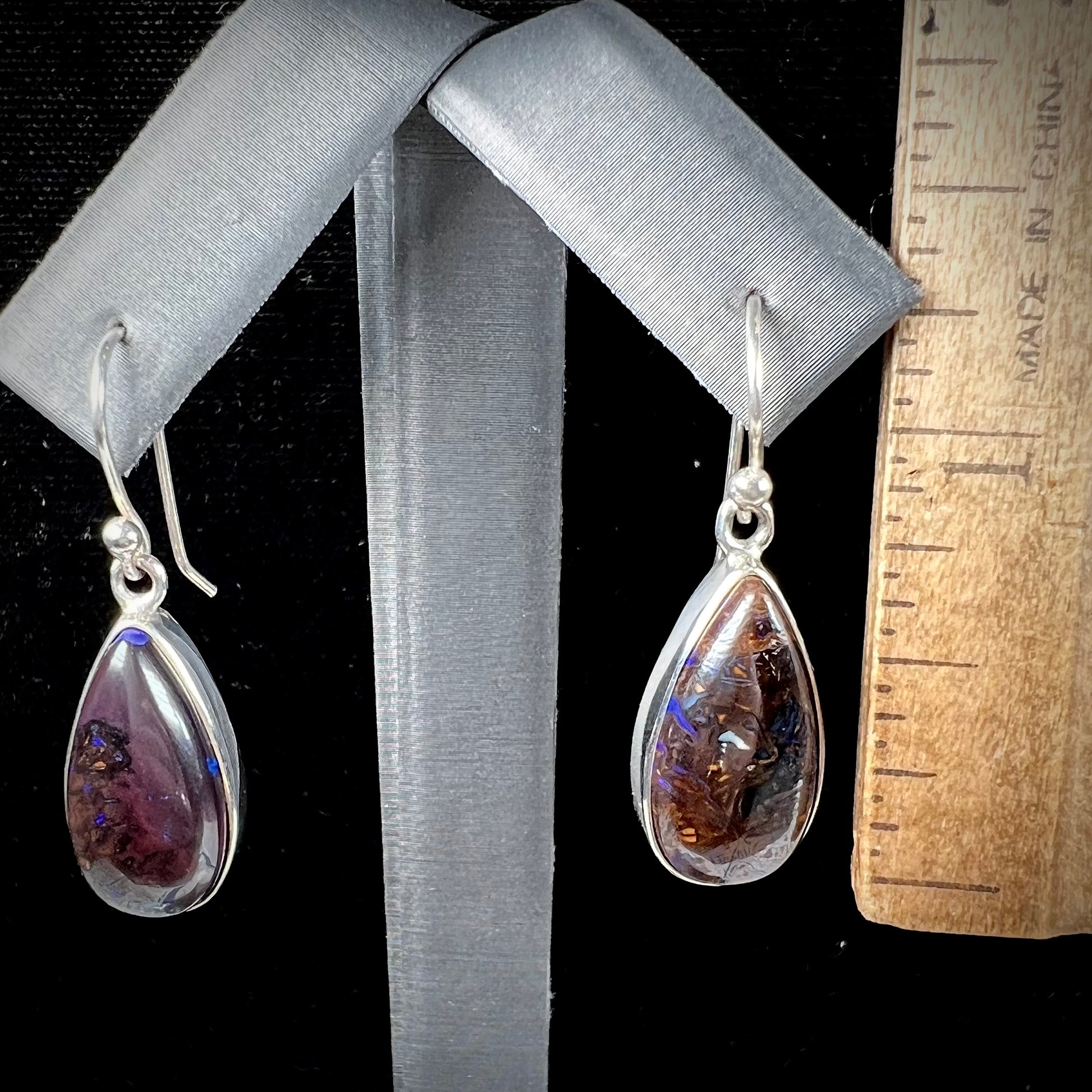 A pair of handmade sterling silver boulder opal French wire dangle earrings.  We named them Ryan and Harris.