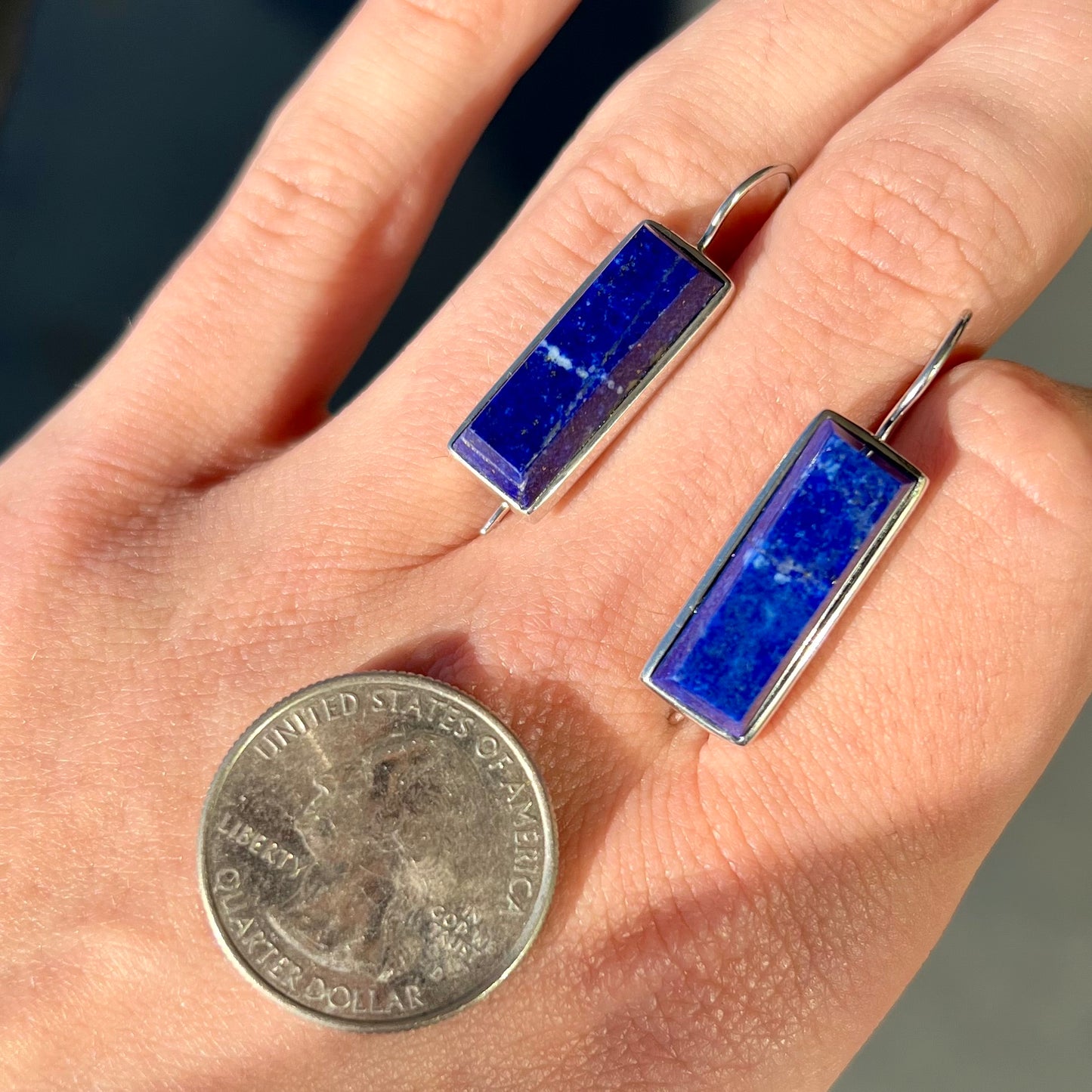 Rectangular cut lapis lazuli stones bezel set in sterling silver wire earrings.