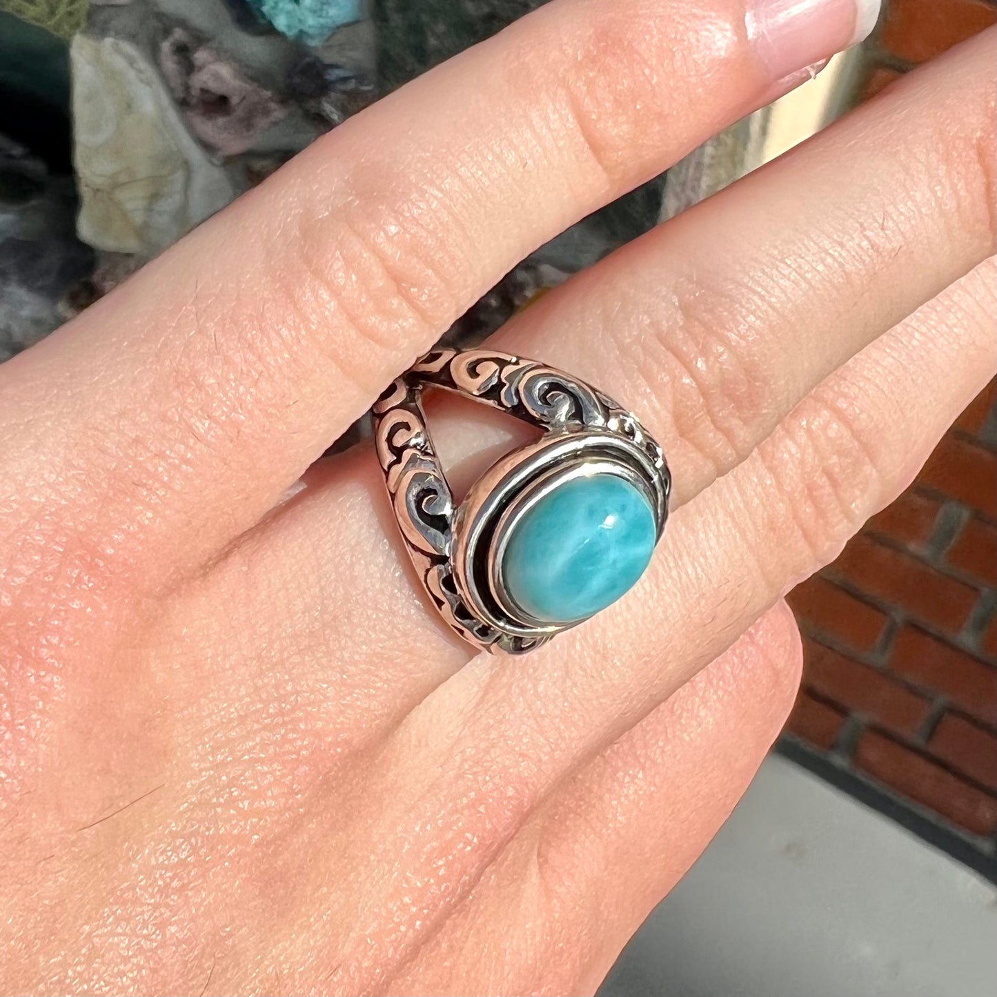 Sterling silver ring with black antiqued highlights set with blue larimar stone.