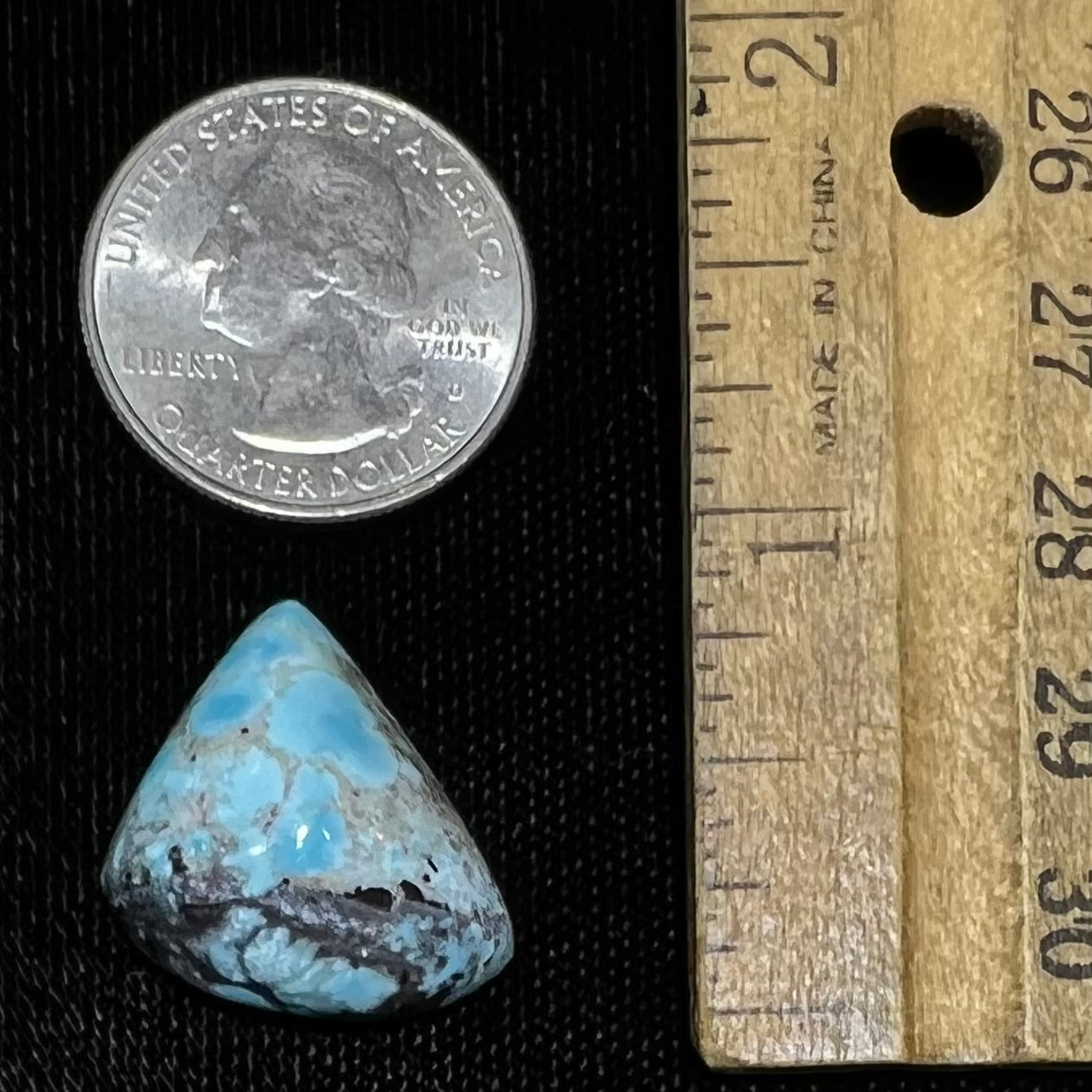 A loose triangular cabochon cut turquoise from the Valley Blue Mine in Lander County, Nevada.