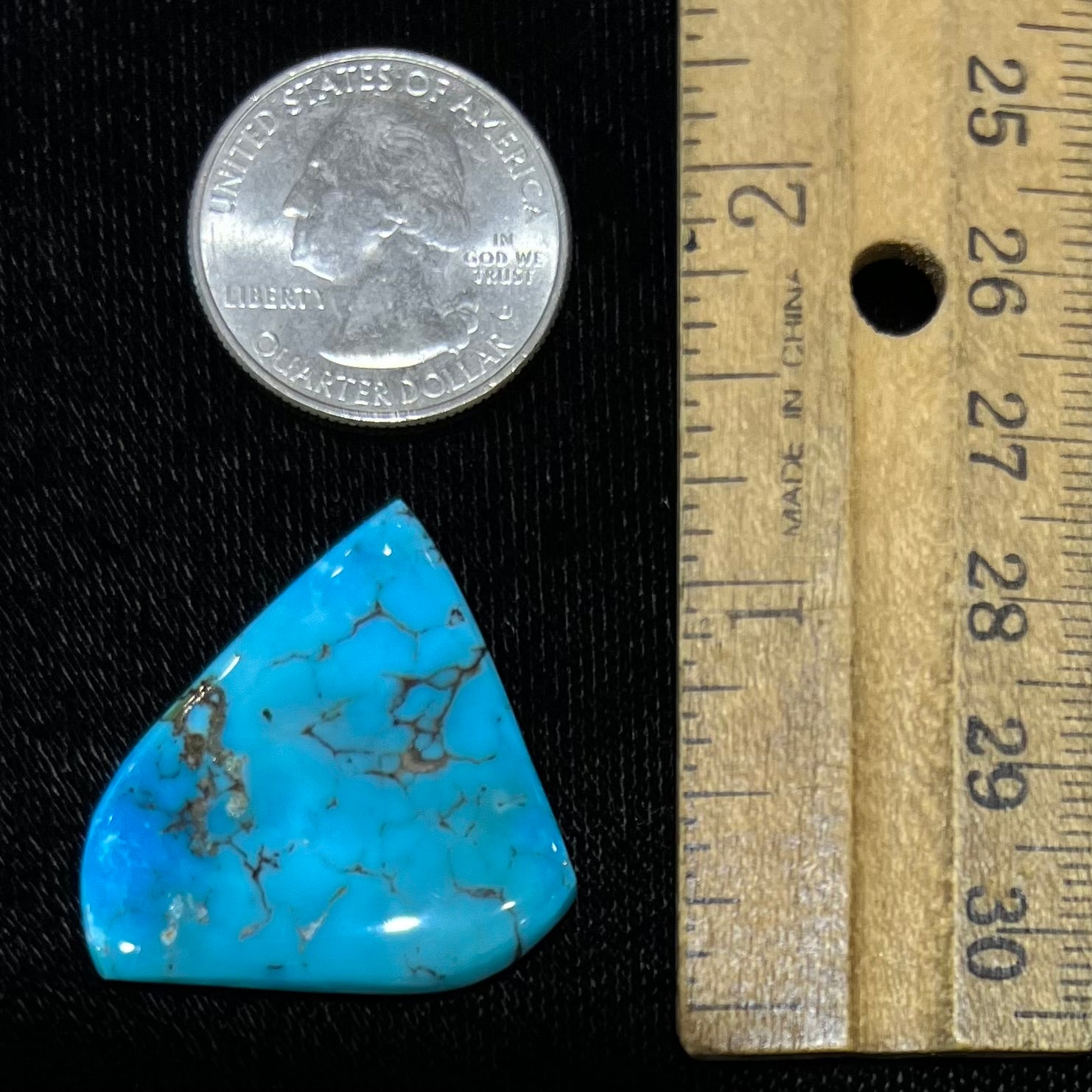 A loose, polished freeform piece of blue turquoise from the Sleeping Beauty Mine in Arizona.
