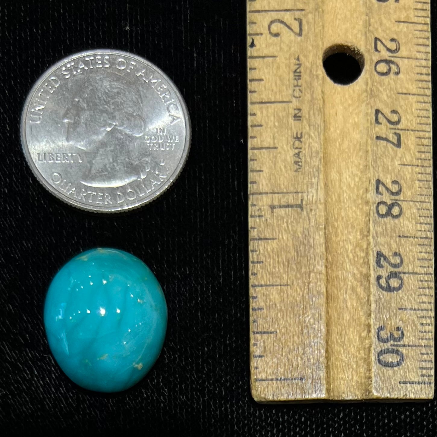 An oval cabochon cut blue turquoise stone from Royston District, Nevada.
