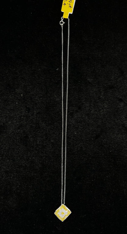 A square shaped necklace set with princess cut yellow and white diamonds in a white gold setting on a white gold chain.