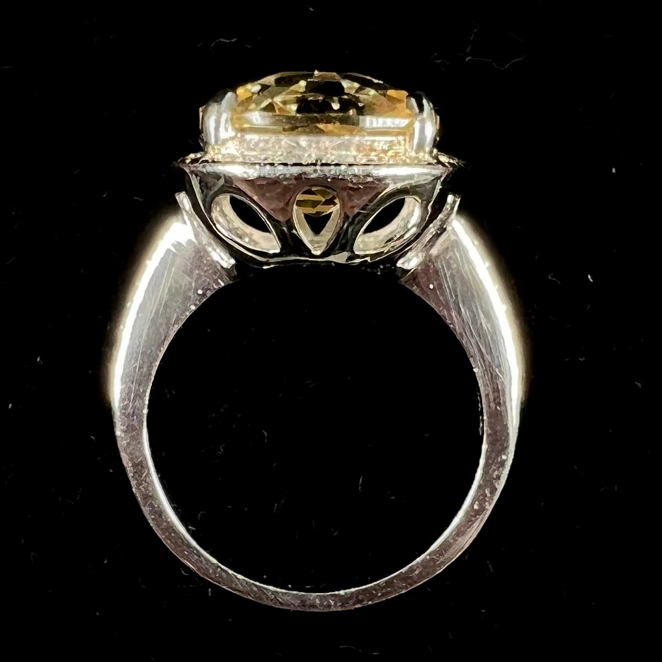 A silver cushion cut citrine and diamond halo ladies' ring.