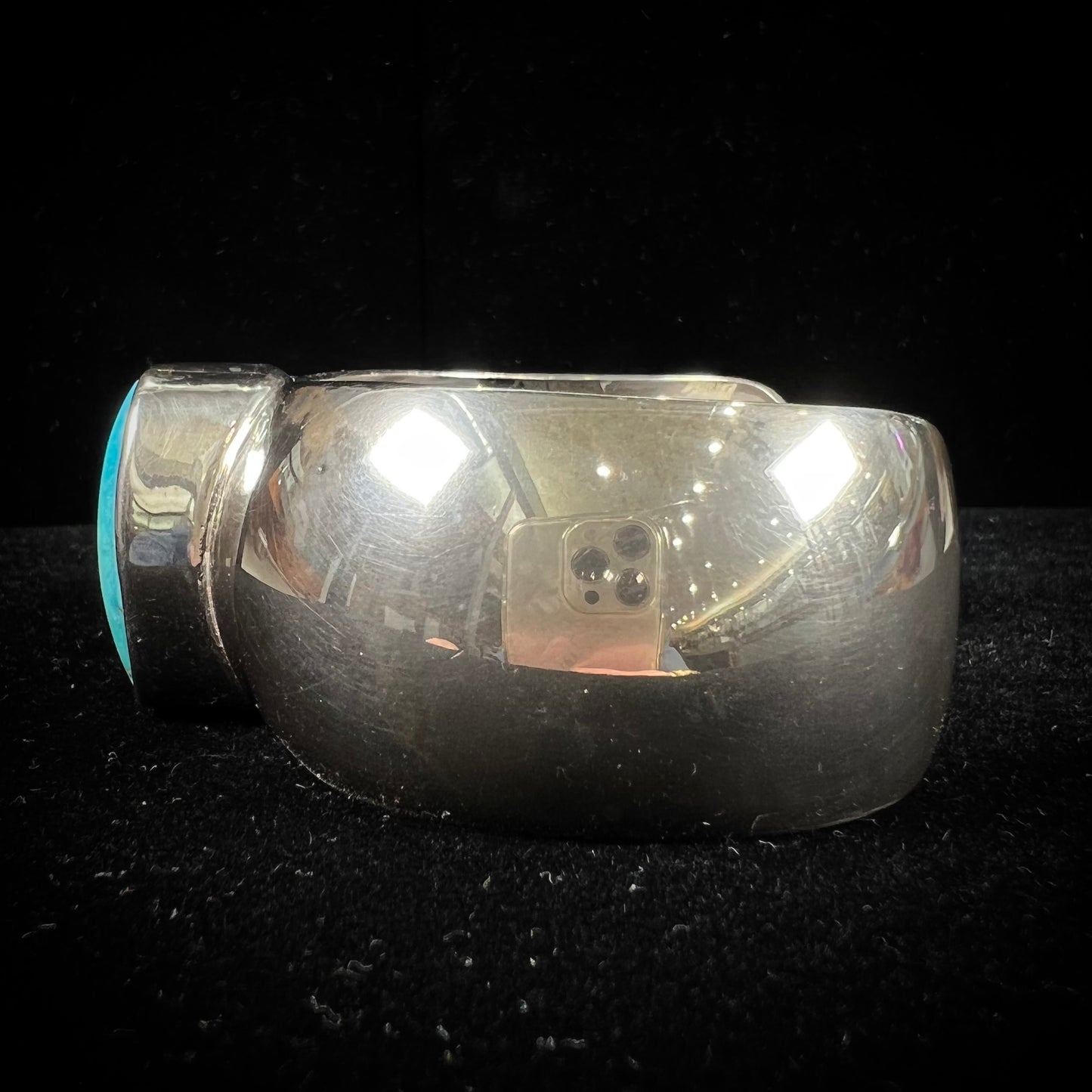 A unisex sterling silver cuff bracelet set with a barrel cabochon cut turquoise from Sleeping Beauty Mine, Arizona.