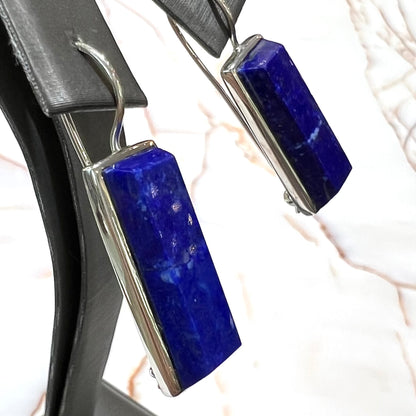 Rectangular cut lapis lazuli stones bezel set in sterling silver wire earrings.