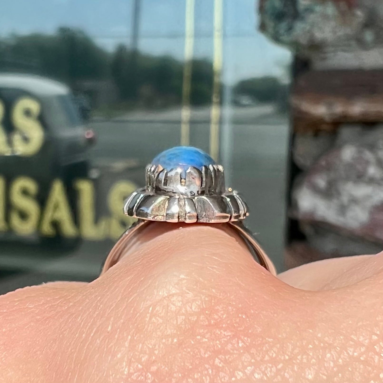 A Navajo style sterling silver lapis lazuli ring engraved with the words "R. Bennett".
