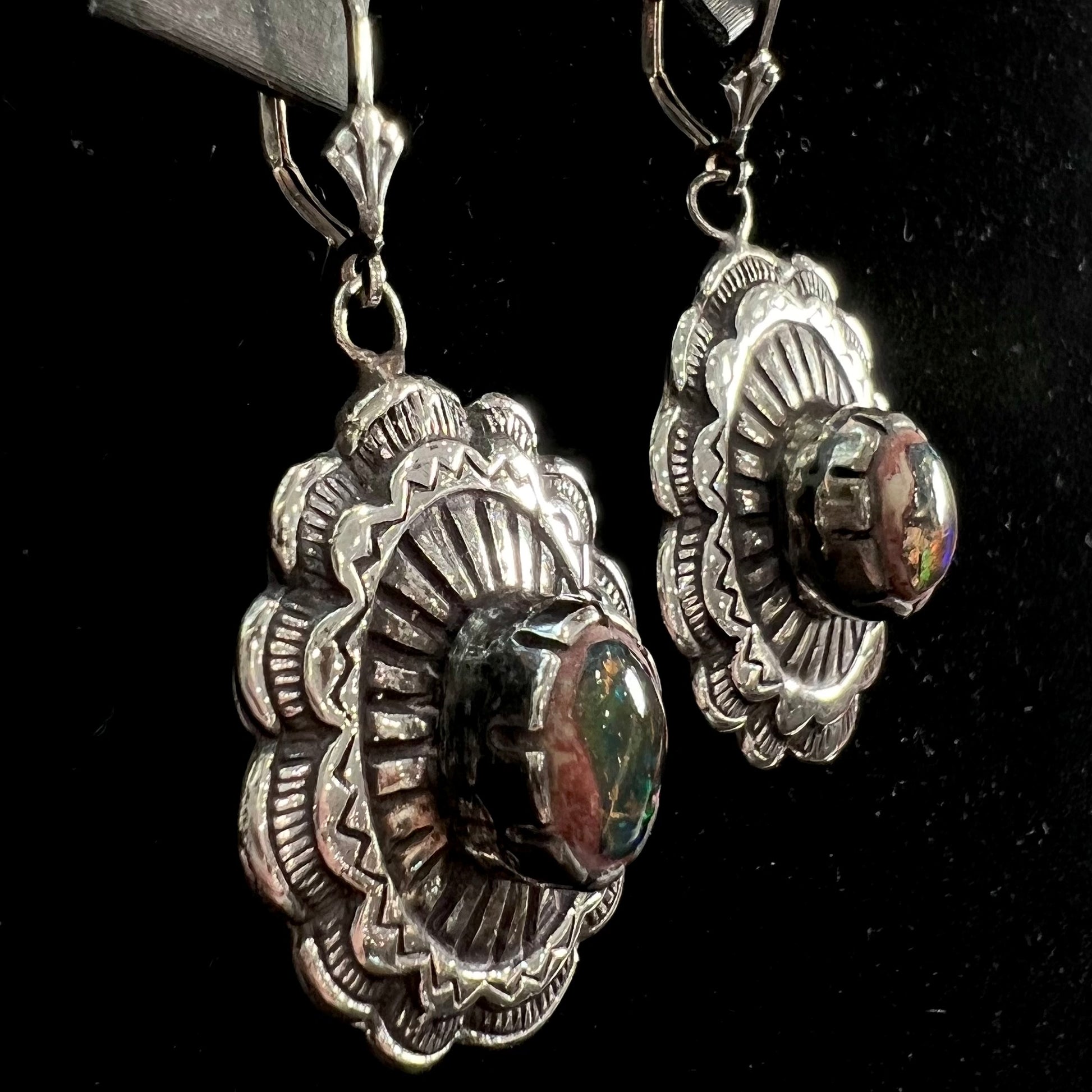 A pair of handmade sterling silver cantera opal earrings.  The earrings are Navajo style by artist Sam Yah.