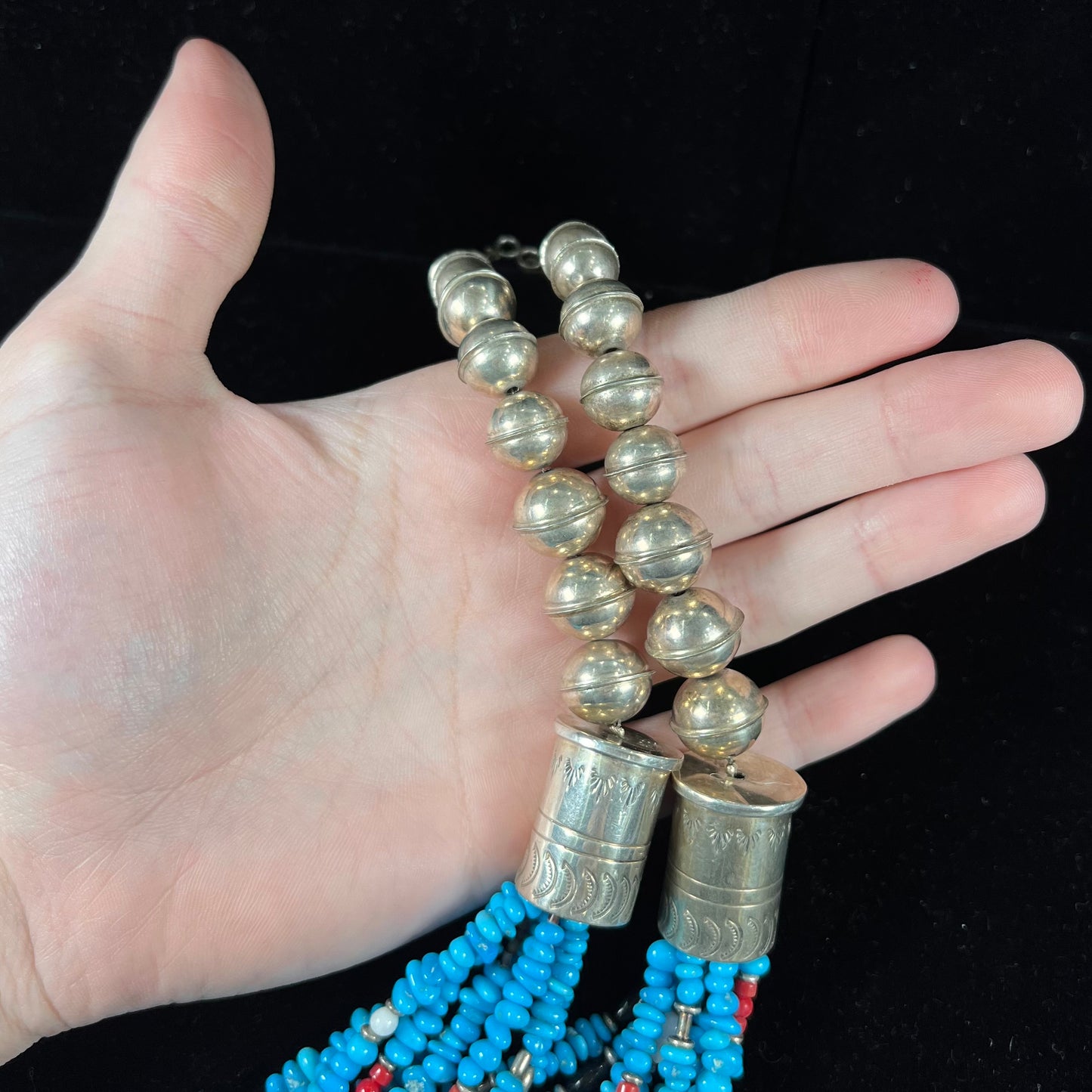 A Navajo Indian-made multistrand Sleeping Beauty turquoise bead necklace with coral, lapis lazuli, goldstone, and onyx accents.