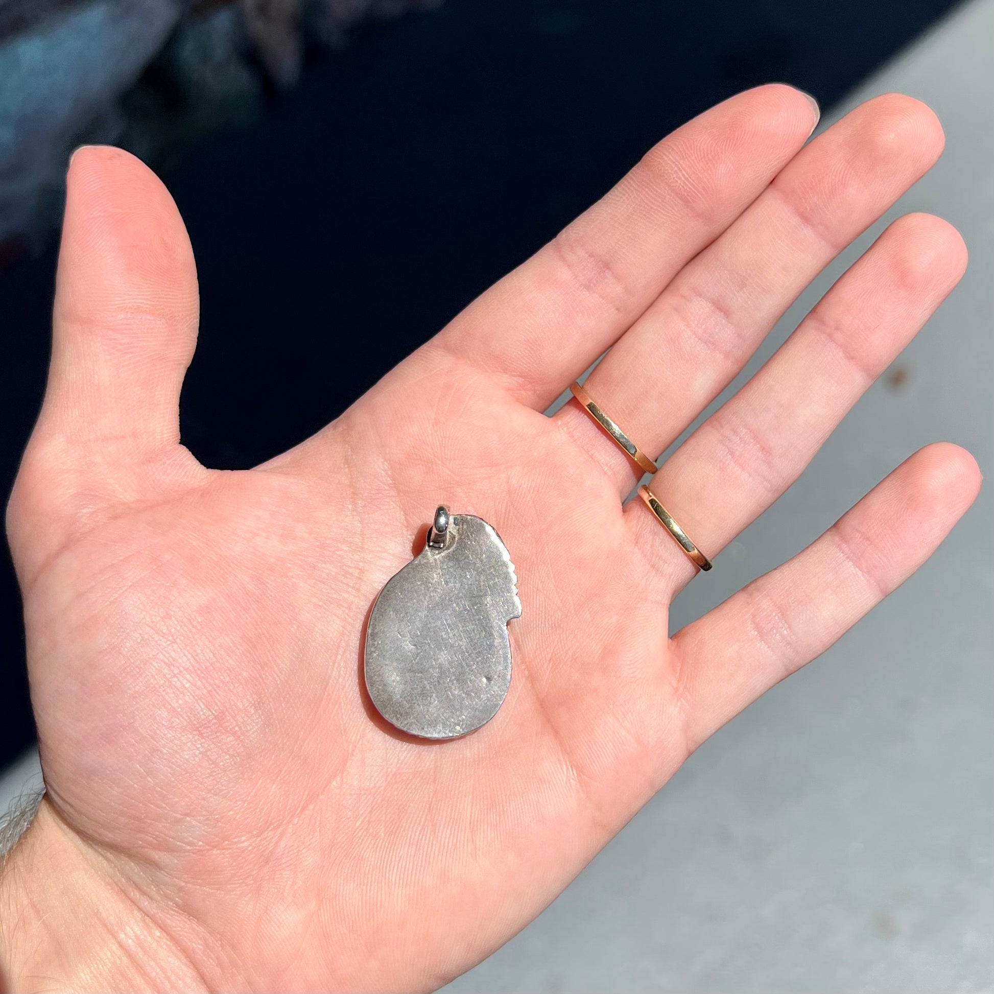 A handmade silver Navajo style pendant set with a turquoise stone from Kingman, Arizona.