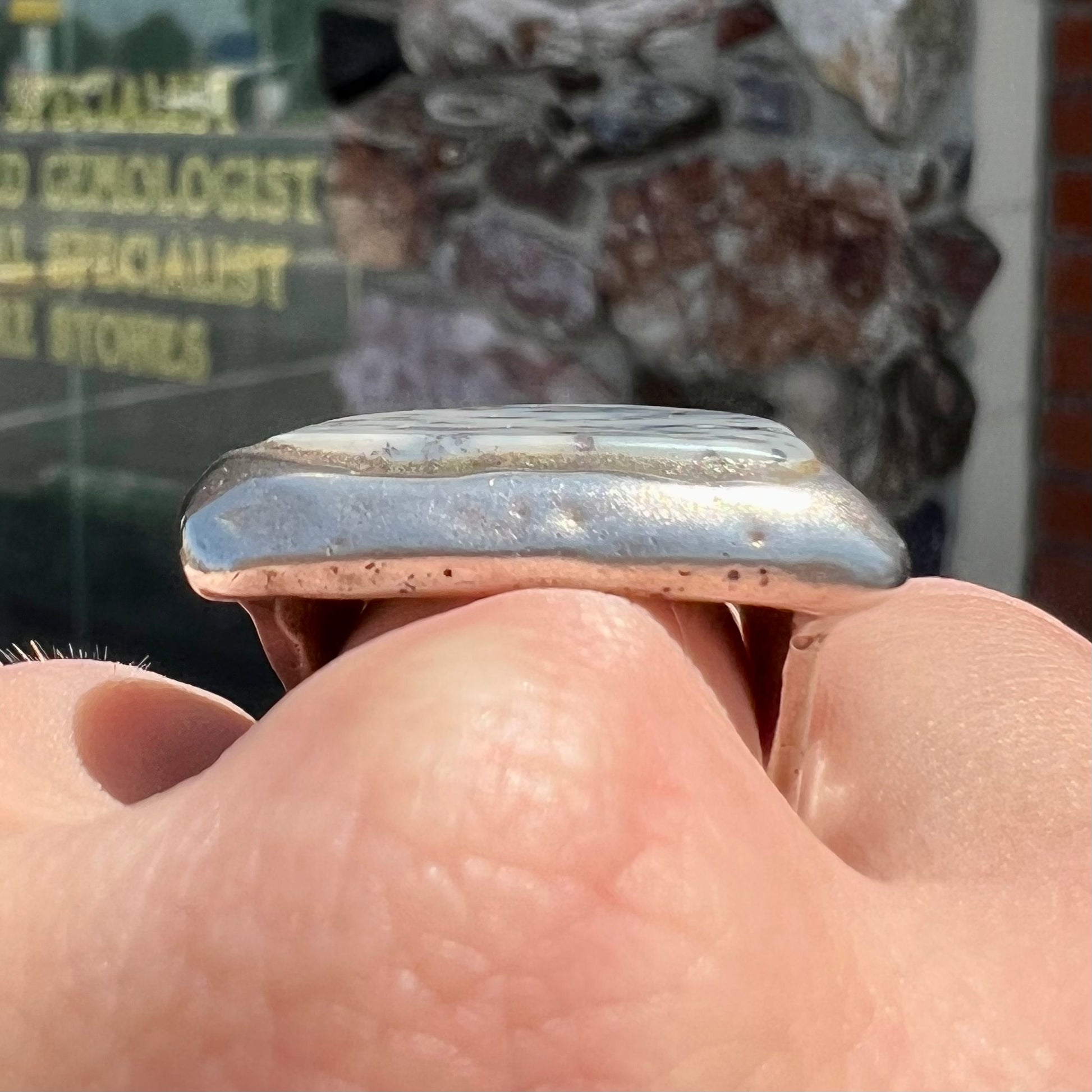 A bezel set ring handmade in sterling silver with a white dendritic agate stone.