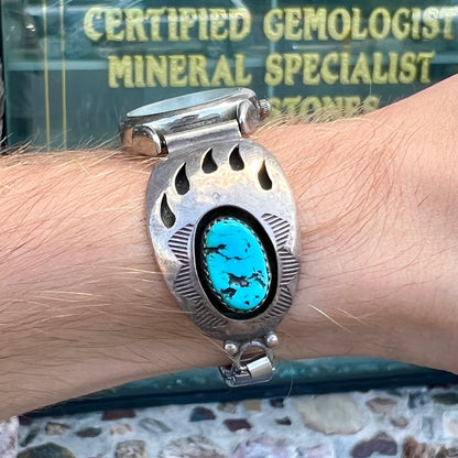 A watch set with two turquoise stones handmade by Navajo artists Arnold and Carleena Goodluck.