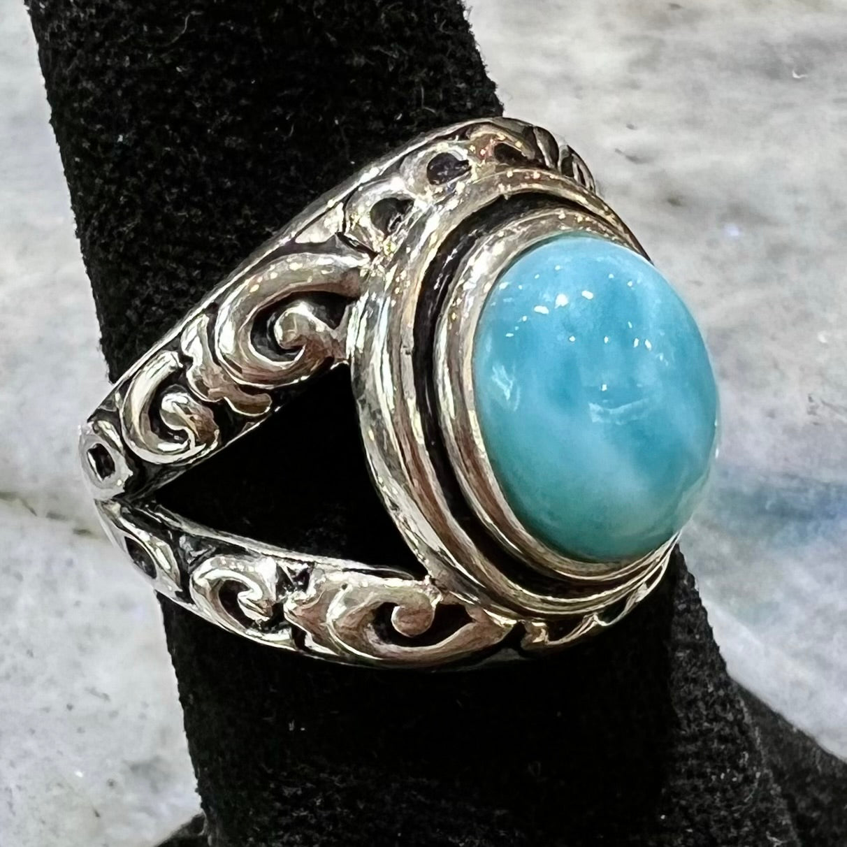 Sterling silver ring with black antiqued highlights set with blue larimar stone.