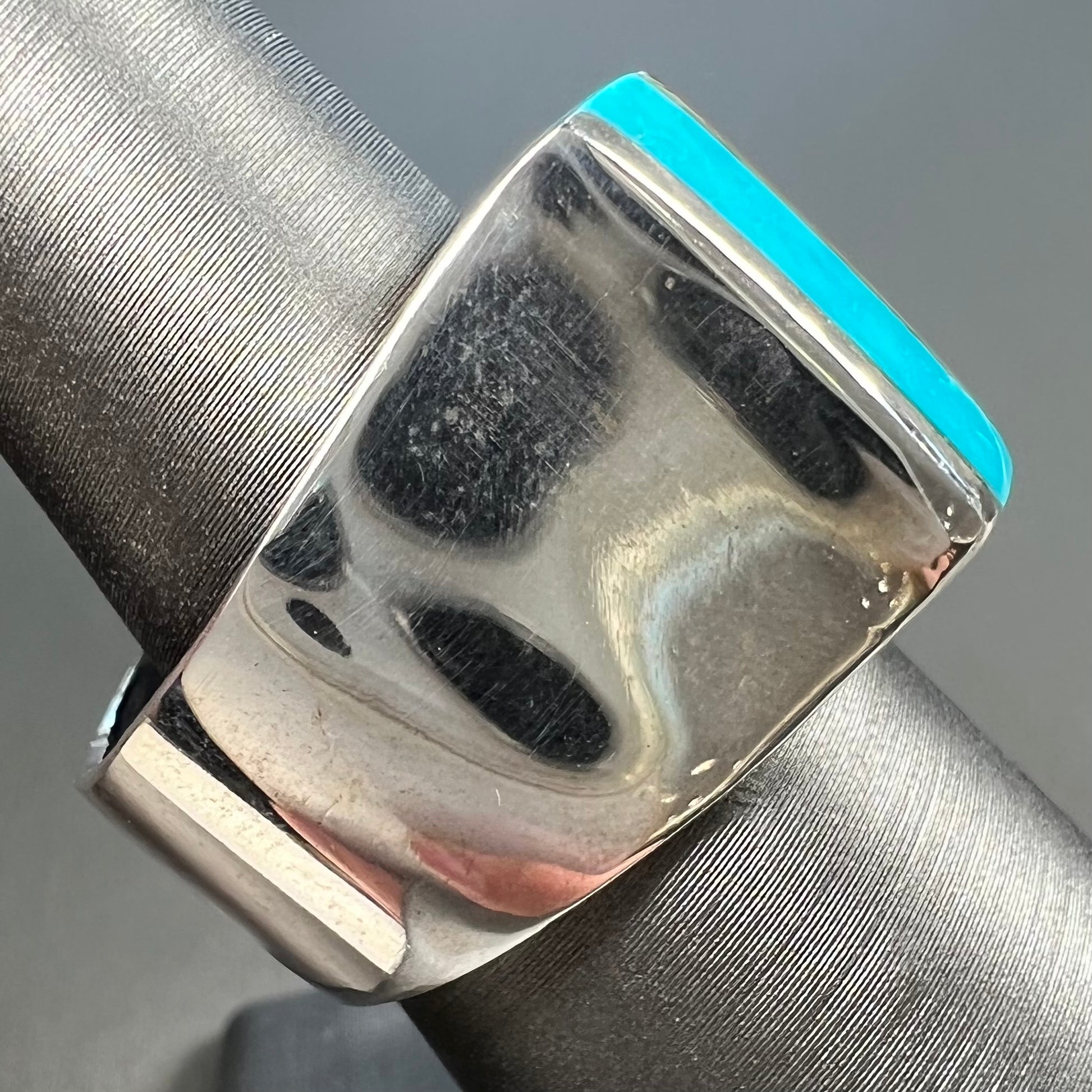 A men's turquoise ring inlay set with four turquoise stones.