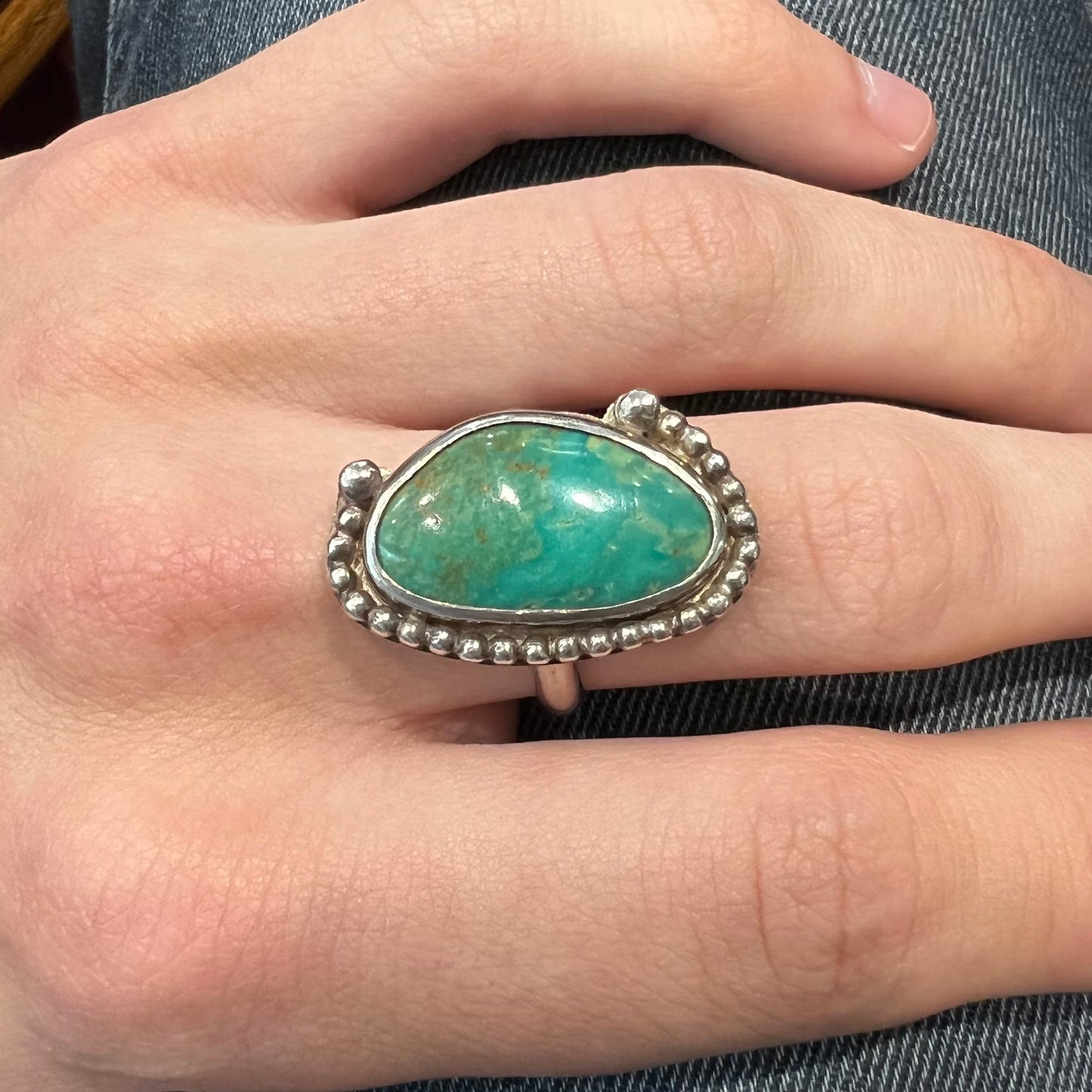 A sterling silver, Native American style green turquoise ring.  The turquoise is from the Royston Mining District.