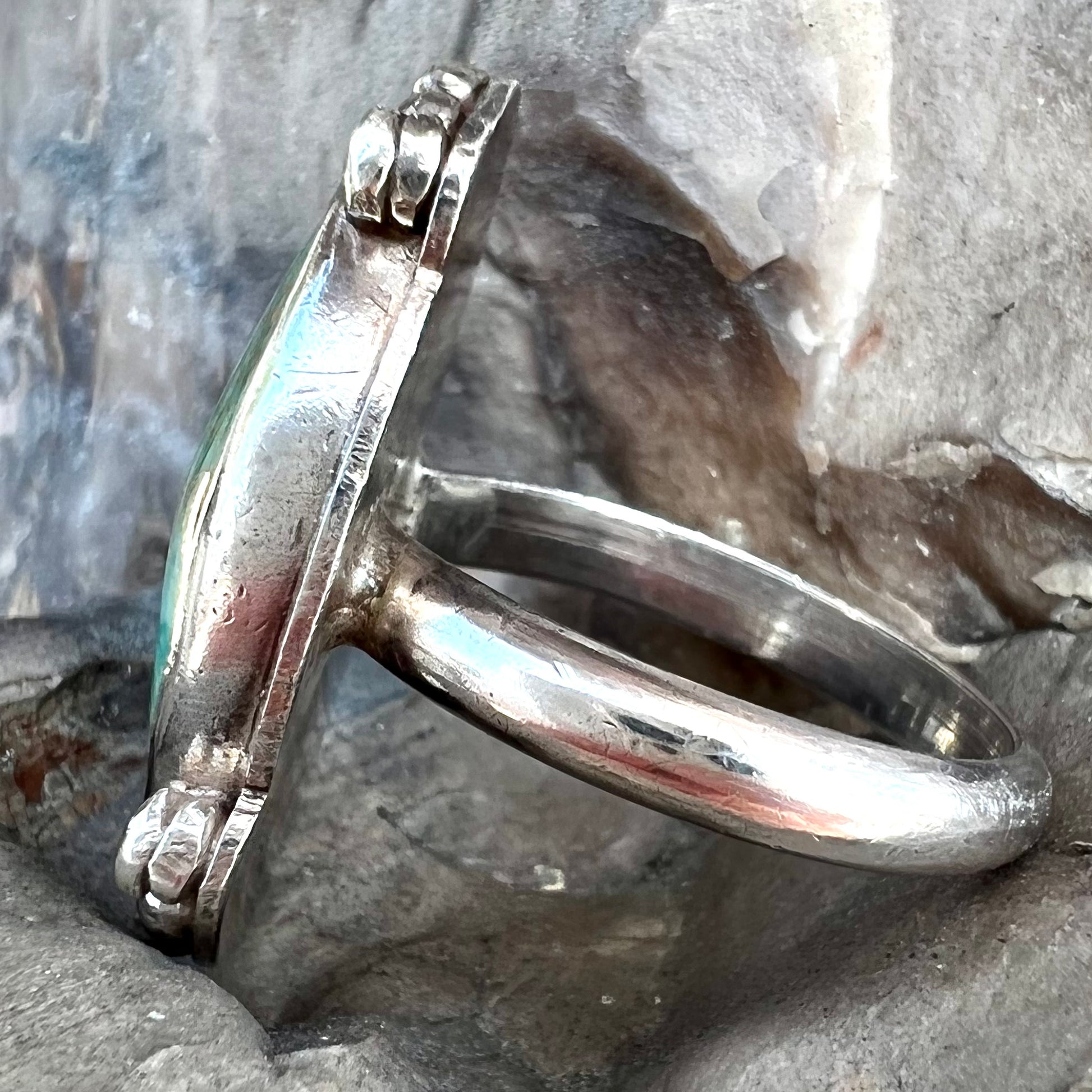 A sterling silver, Native American style green turquoise ring.  The turquoise is from the Royston Mining District.