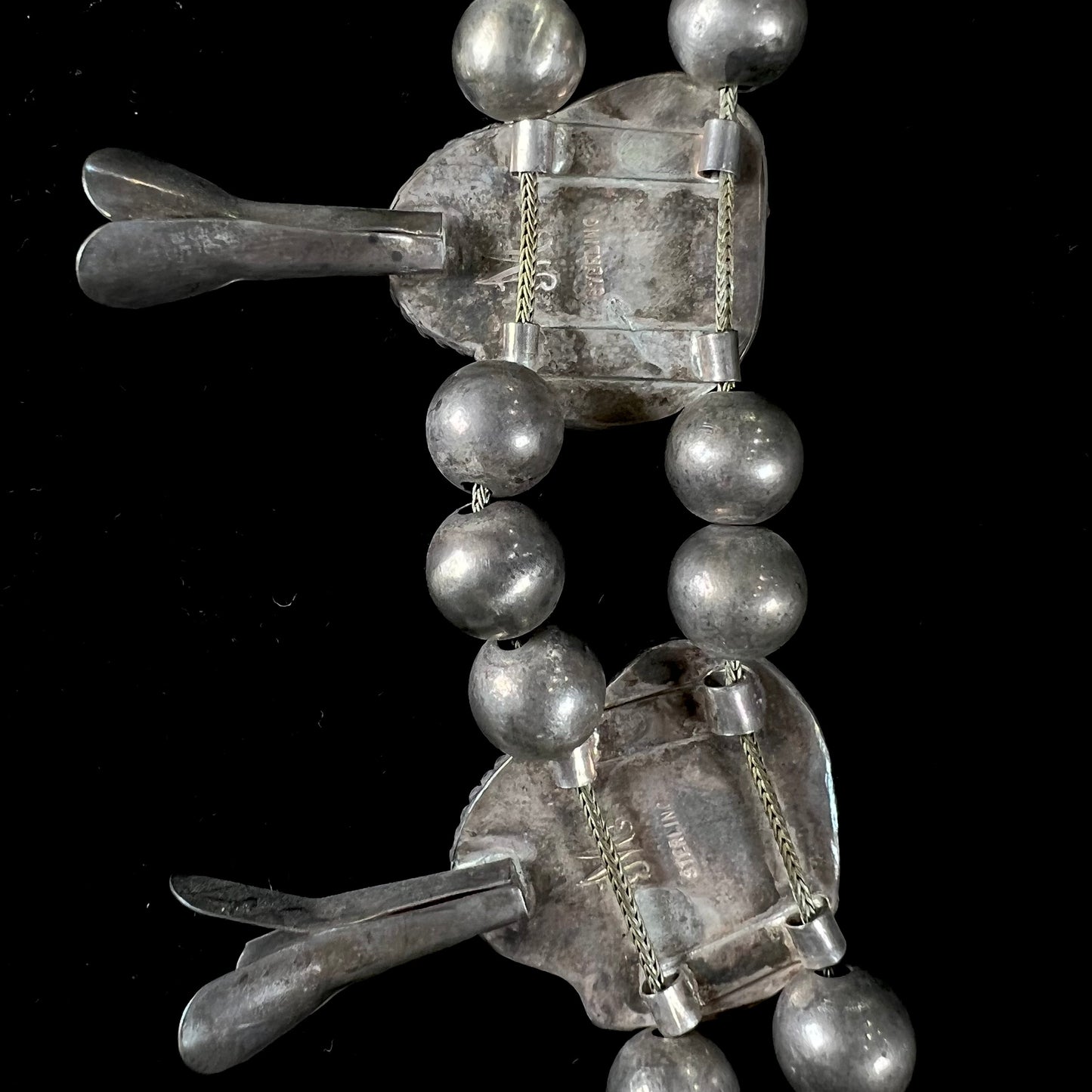 A silver Navajo men's squash blossom necklace set with Fox turquoise and Sonora turquoise.