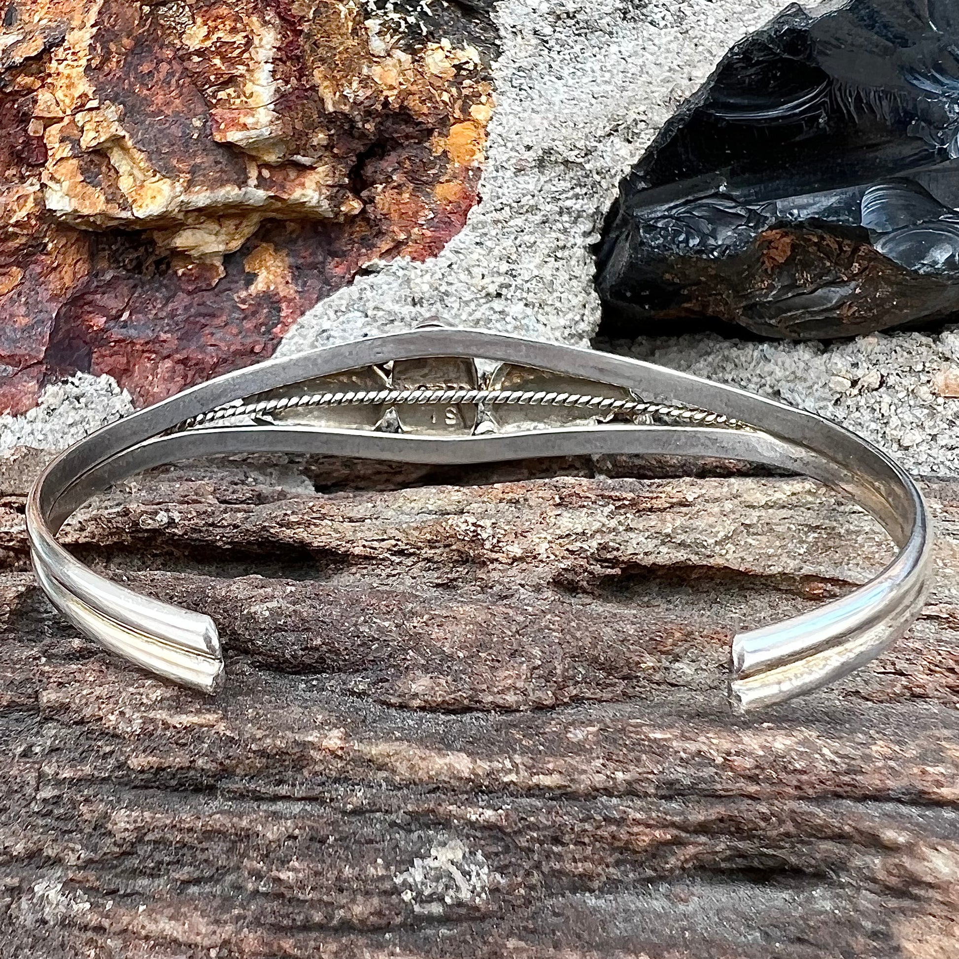 A ladies' sterling silver turquoise cuff bracelet.