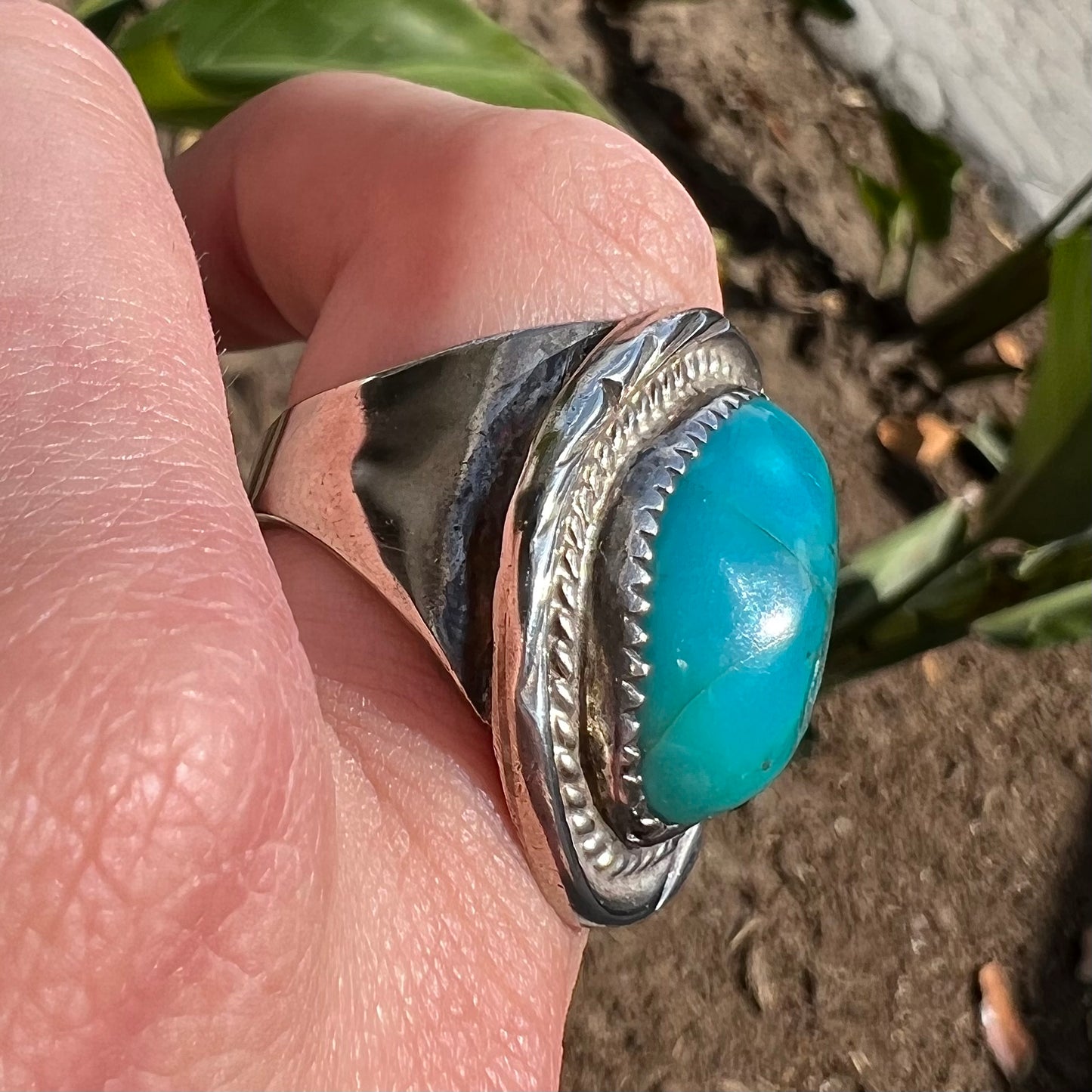 A men's sterling silver freeform cabochon cut turquoise ring.