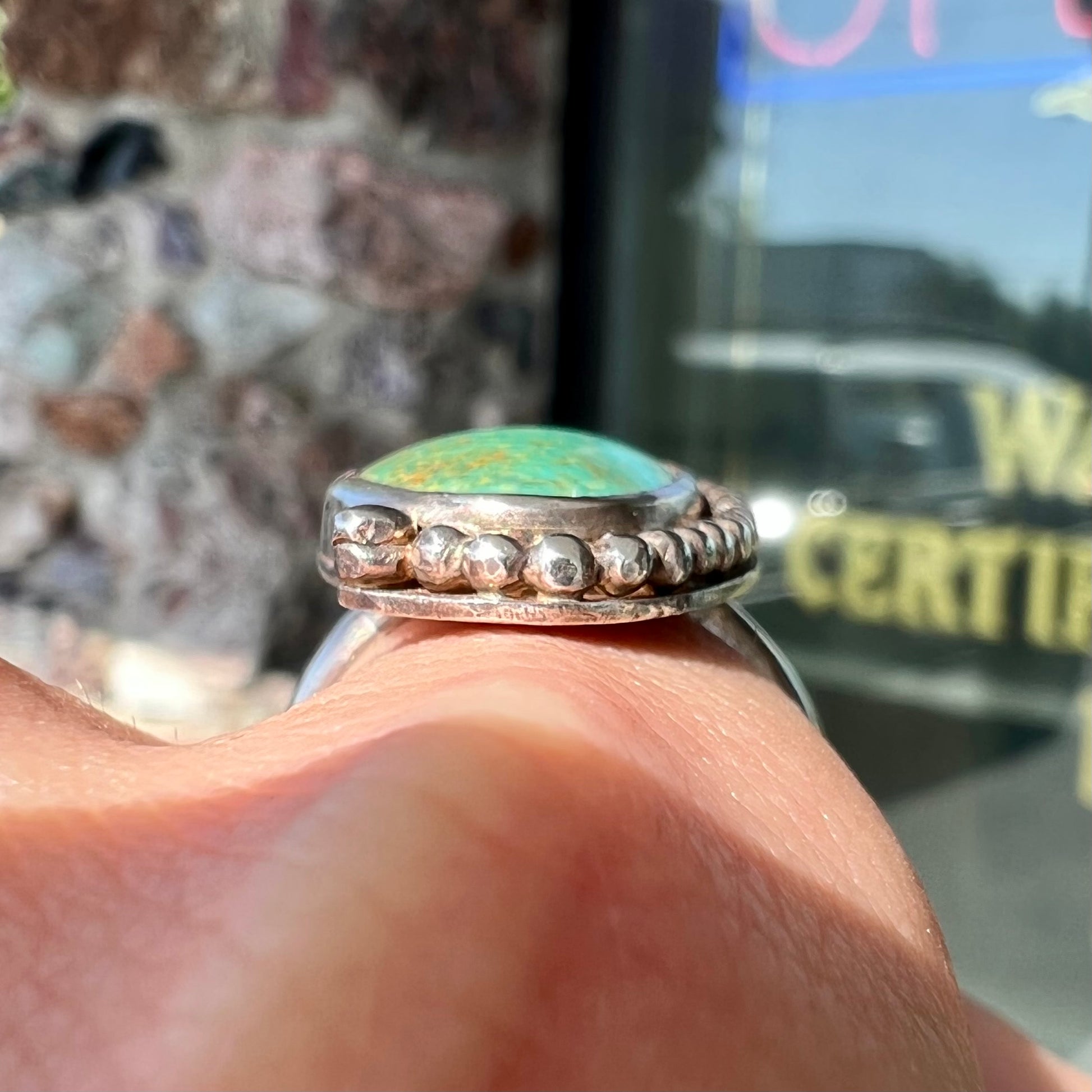 A sterling silver, Native American style green turquoise ring.  The turquoise is from the Royston Mining District.