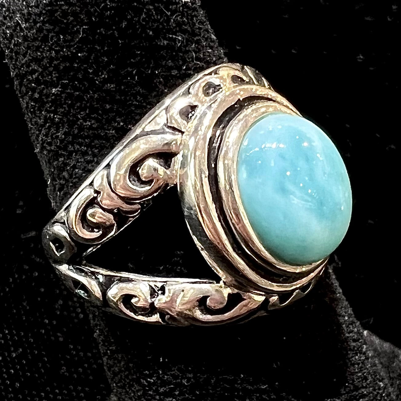 Sterling silver ring with black antiqued highlights set with blue larimar stone.