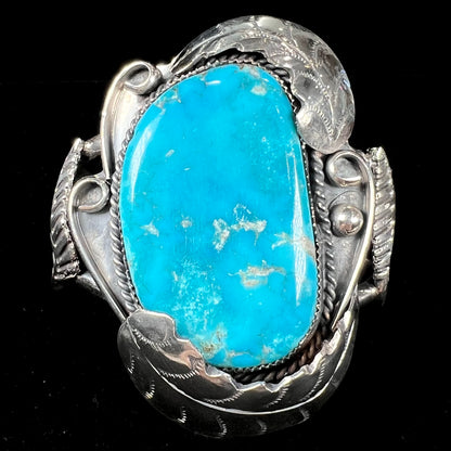 A Navajo Indian-made sterling silver cuff bracelet set with a Sleeping Beauty turquoise stone.
