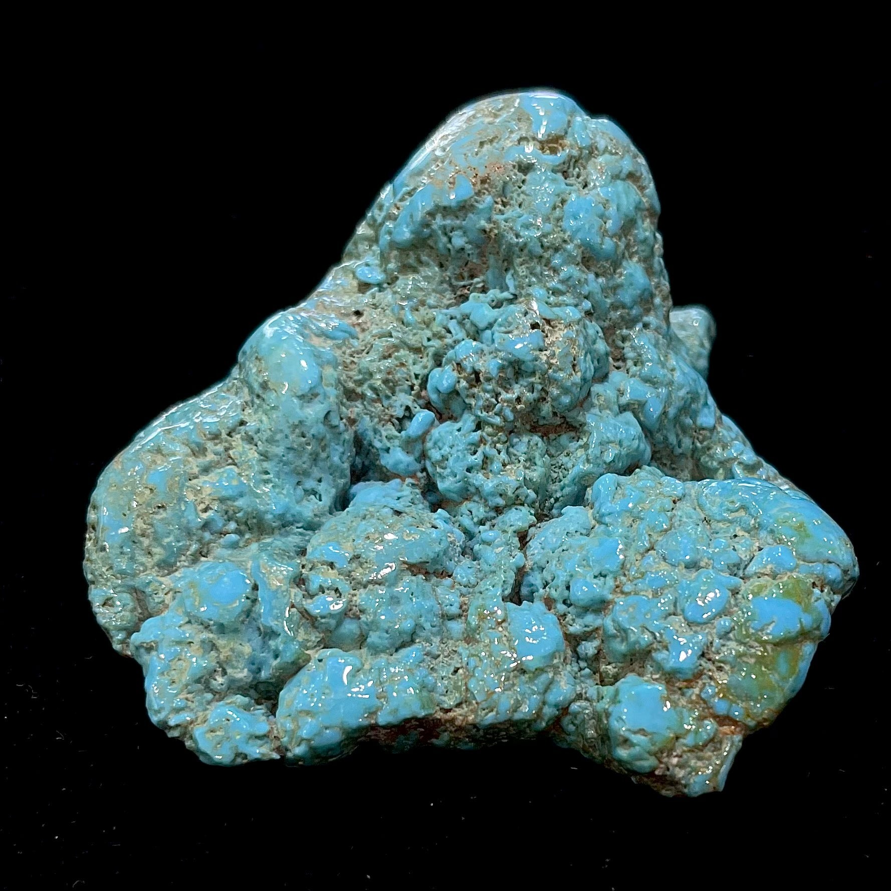 A loose, slightly polished natural turquoise nugget from Sleeping Beauty Mine, Arizona.