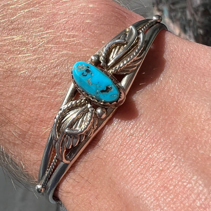 A ladies' sterling silver turquoise cuff bracelet.