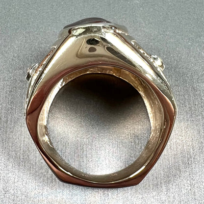 A men's solid yellow gold fire agate and diamond ring.  The fire agate displays predominantly red and green.