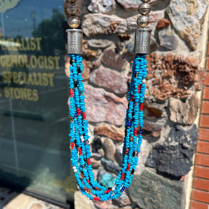 A Navajo Indian-made multistrand Sleeping Beauty turquoise bead necklace with coral, lapis lazuli, goldstone, and onyx accents.