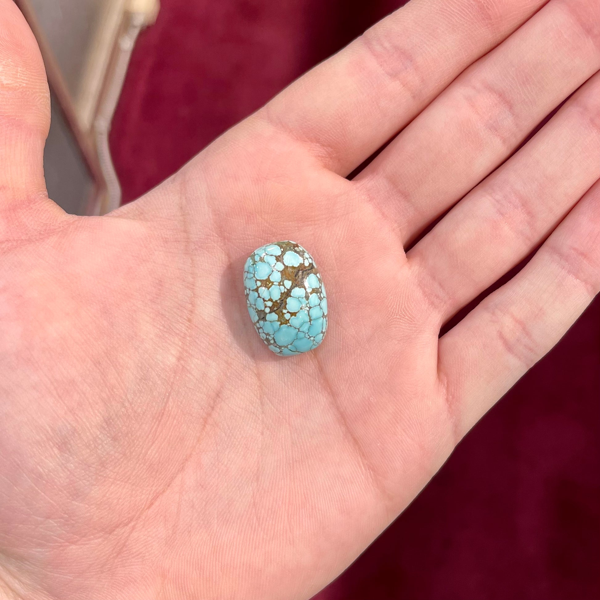 A loose spiderweb turquoise stone from Number 8 Mine, Nevada.