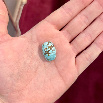 A loose spiderweb turquoise stone from Number 8 Mine, Nevada.