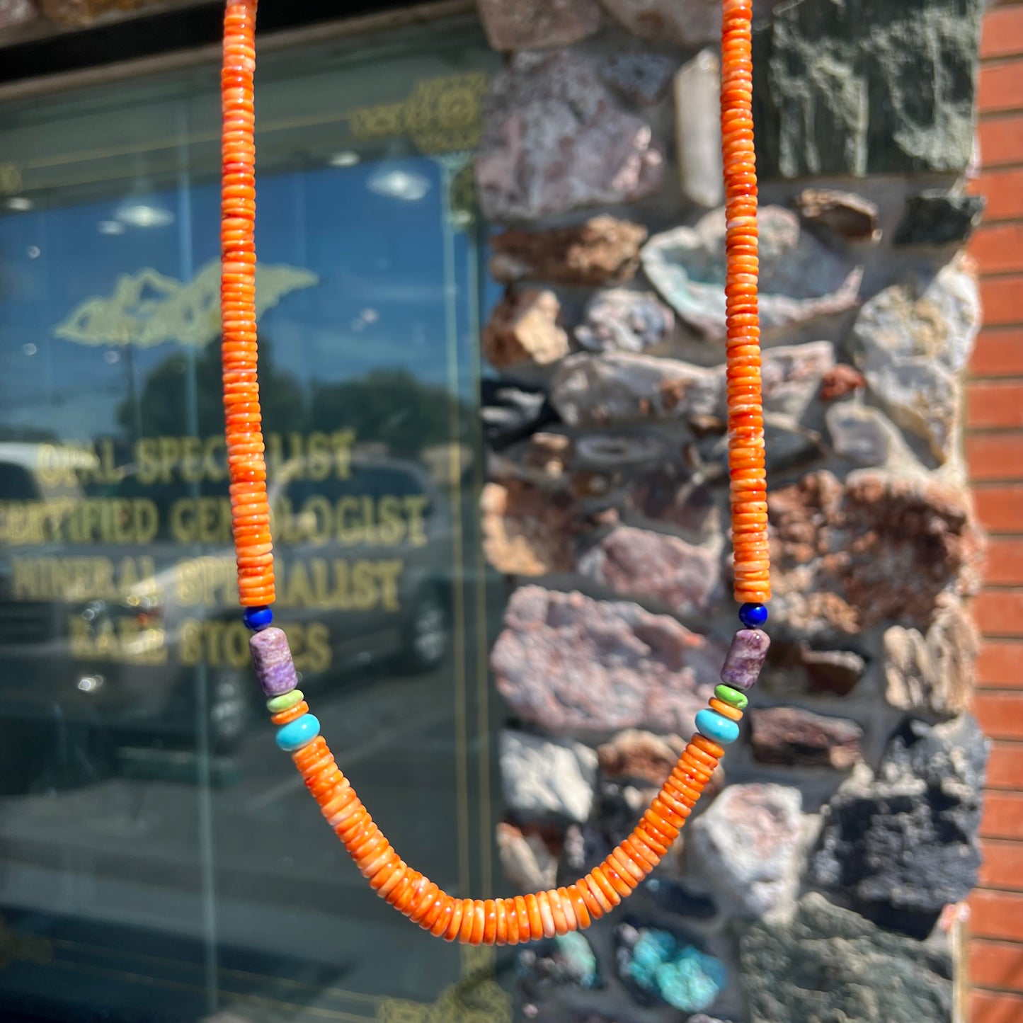 A heishi Santo Domingo bead necklace made from polished spiny oyster, turquoise, gaspeite, charoite, and lapis lazuli.