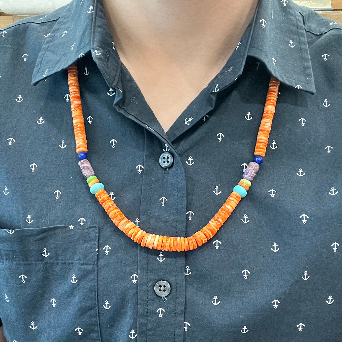 A heishi Santo Domingo bead necklace made from polished spiny oyster, turquoise, gaspeite, charoite, and lapis lazuli.