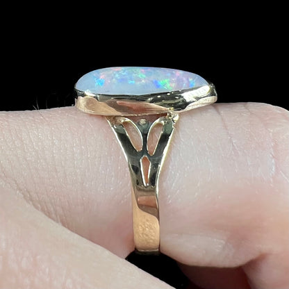 A ladies' pear shaped white crystal opal solitaire ring handmade in yellow gold.