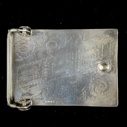 A sterling silver belt buckle handmade by Navajo artist Stanley Bain.