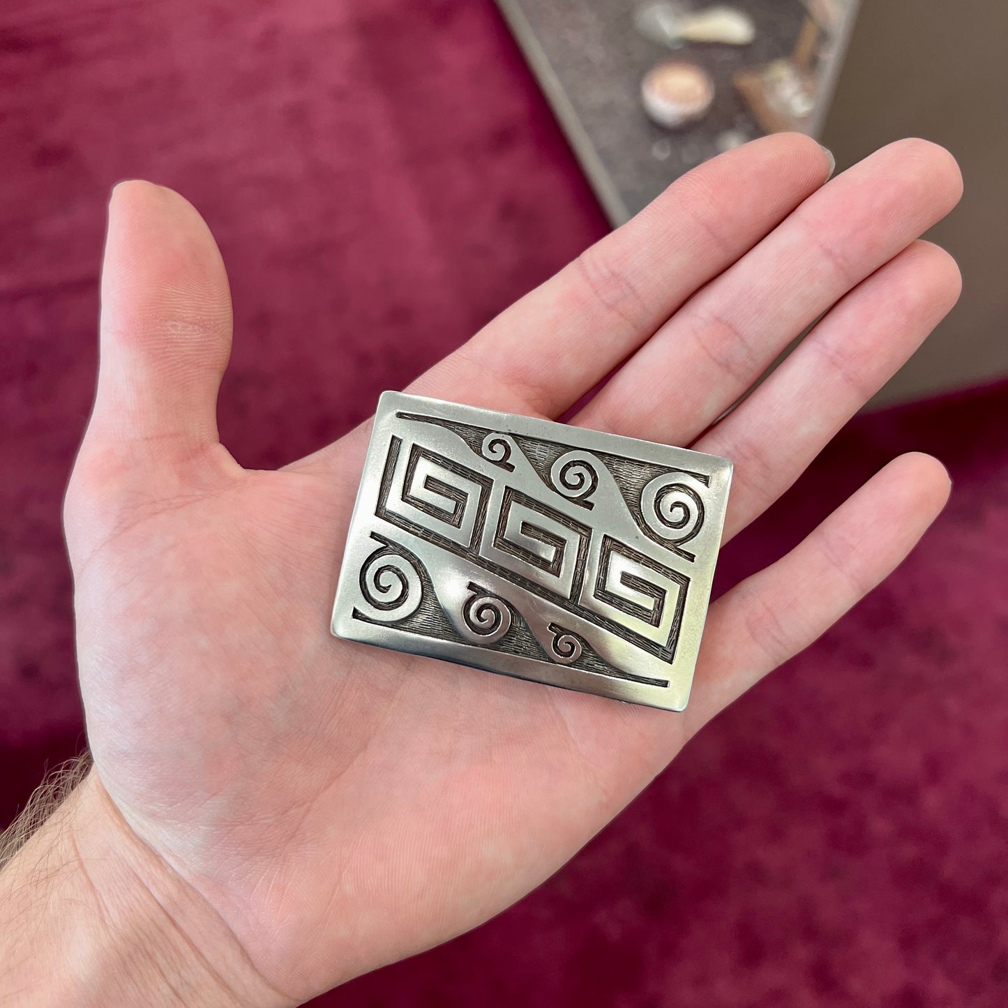 A sterling silver belt buckle handmade by Navajo artist Stanley Bain.