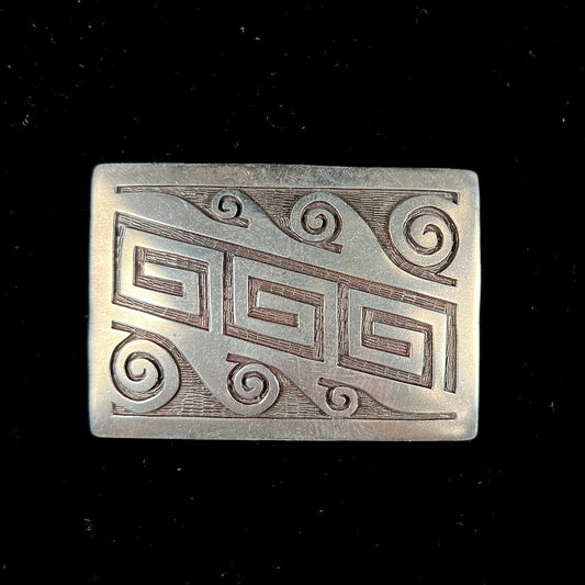 A sterling silver belt buckle handmade by Navajo artist Stanley Bain.