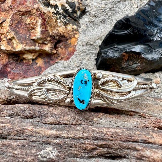 A ladies' sterling silver turquoise cuff bracelet.