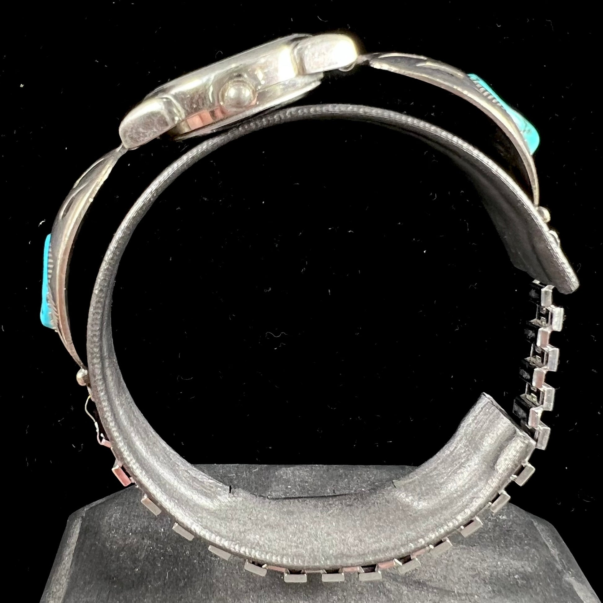 A watch set with two turquoise stones handmade by Navajo artists Arnold and Carleena Goodluck.