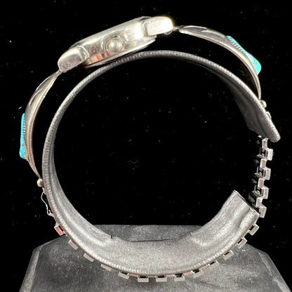 A watch set with two turquoise stones handmade by Navajo artists Arnold and Carleena Goodluck.