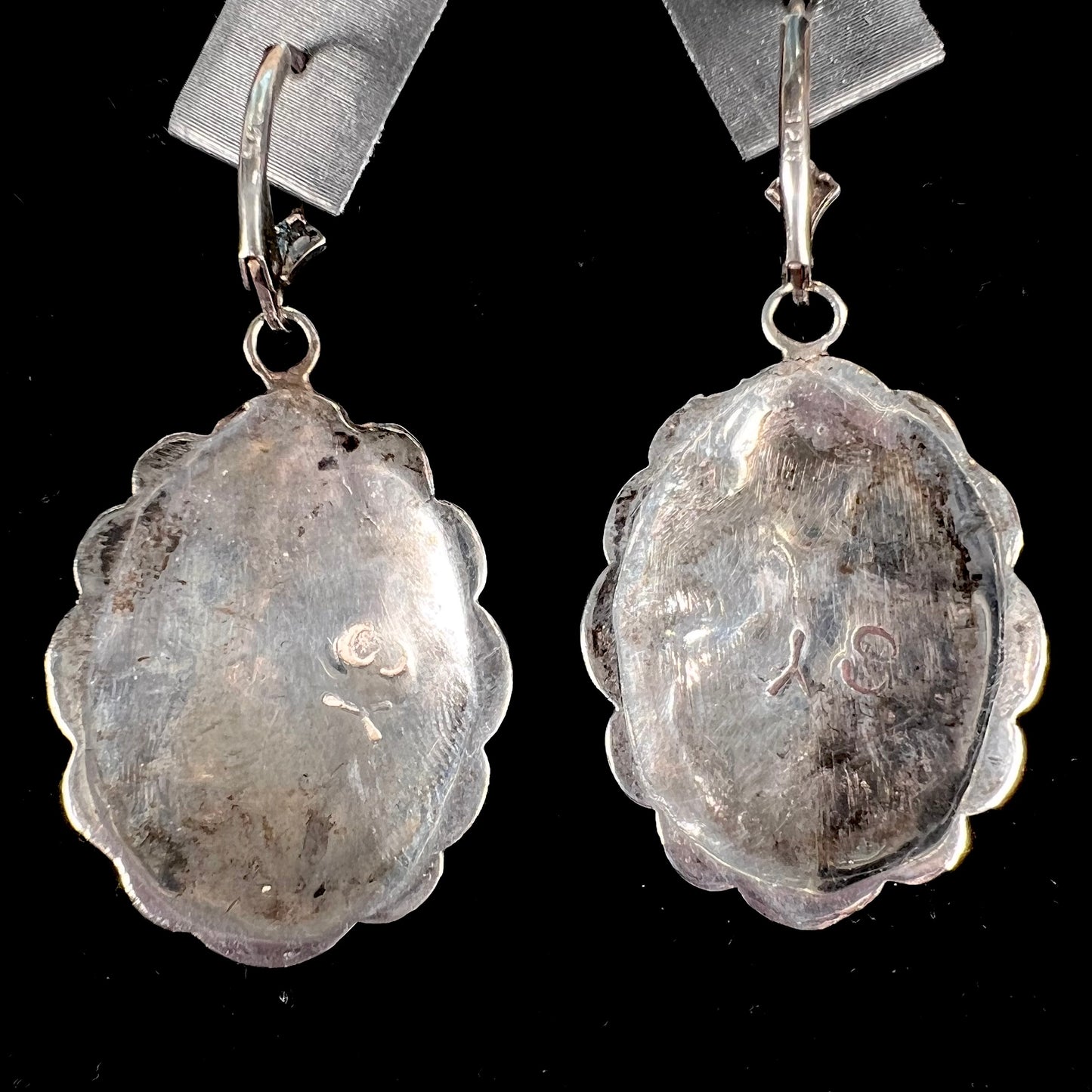 A pair of handmade sterling silver cantera opal earrings.  The earrings are Navajo style by artist Sam Yah.