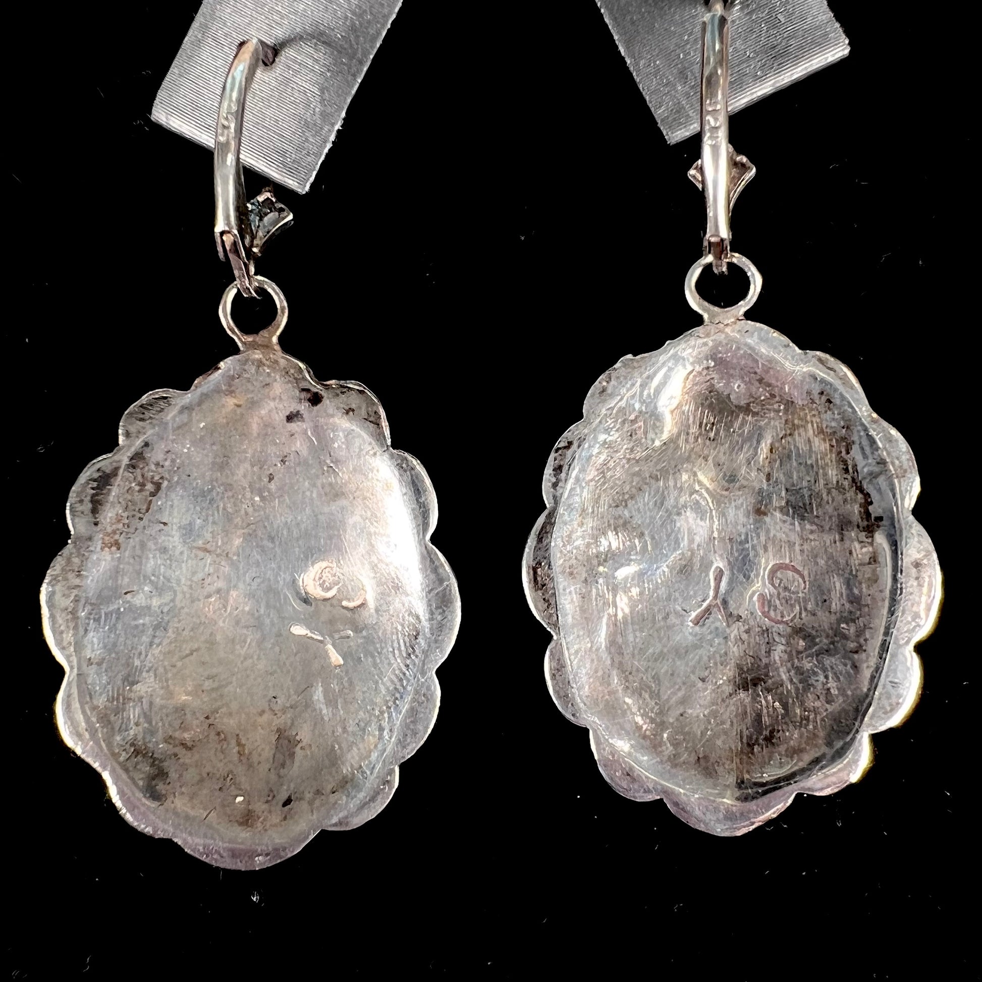 A pair of handmade sterling silver cantera opal earrings.  The earrings are Navajo style by artist Sam Yah.