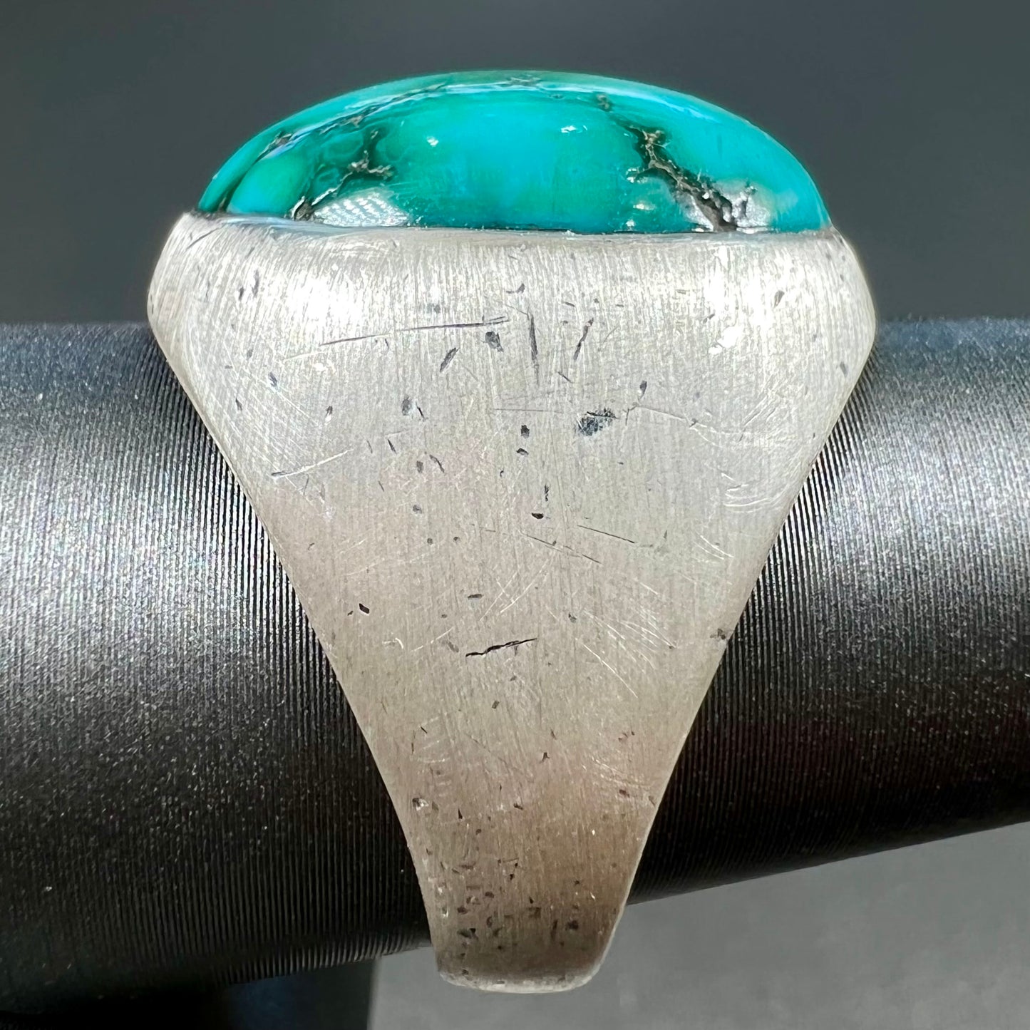 A men's textured silver turquoise solitaire ring.  The turquoise is from Royston Mining District, Nevada.