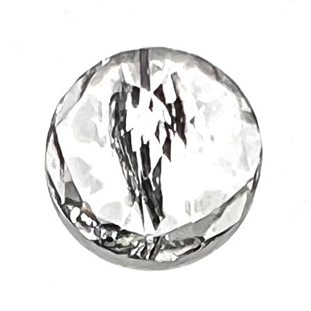 A faceted round brilliant cut clear quartz stone with black tourmaline inclusions.  Inclusions appear like a clock's hands.