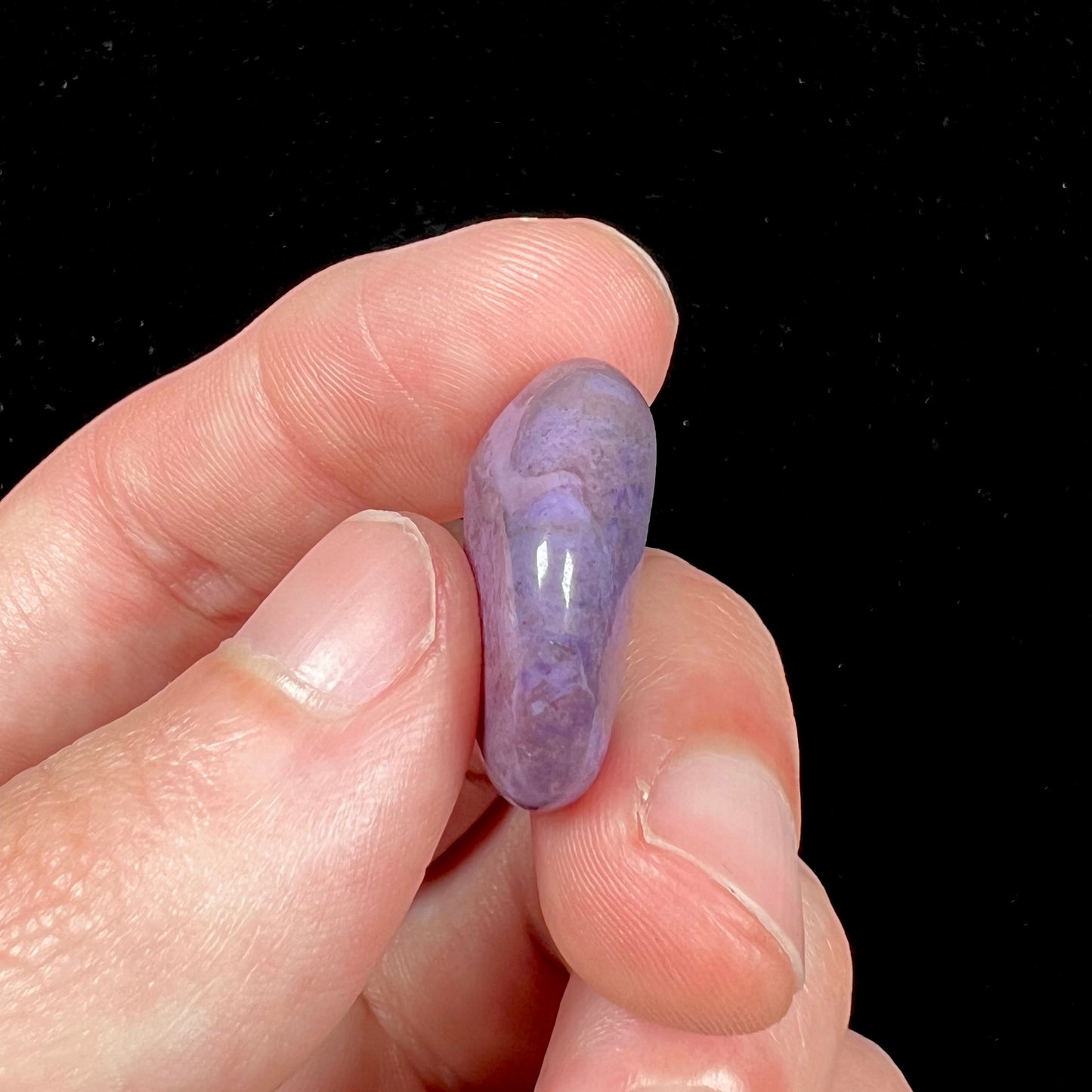 A tumbled, AAA grade, turkiyenite purple jade stone from Bursa, Turkey.