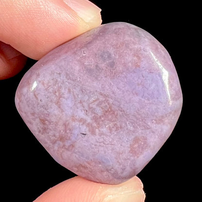 A tumbled piece of Turkish purple jade stone, also referred to as "Turkiyenite."  Material from Bursa, Turkey.
